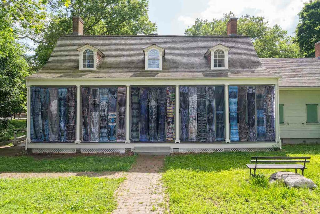 Lefferts Historic House facade with Adama Delphine Fawundu's "Ancestral Whisper's" site specific installation.